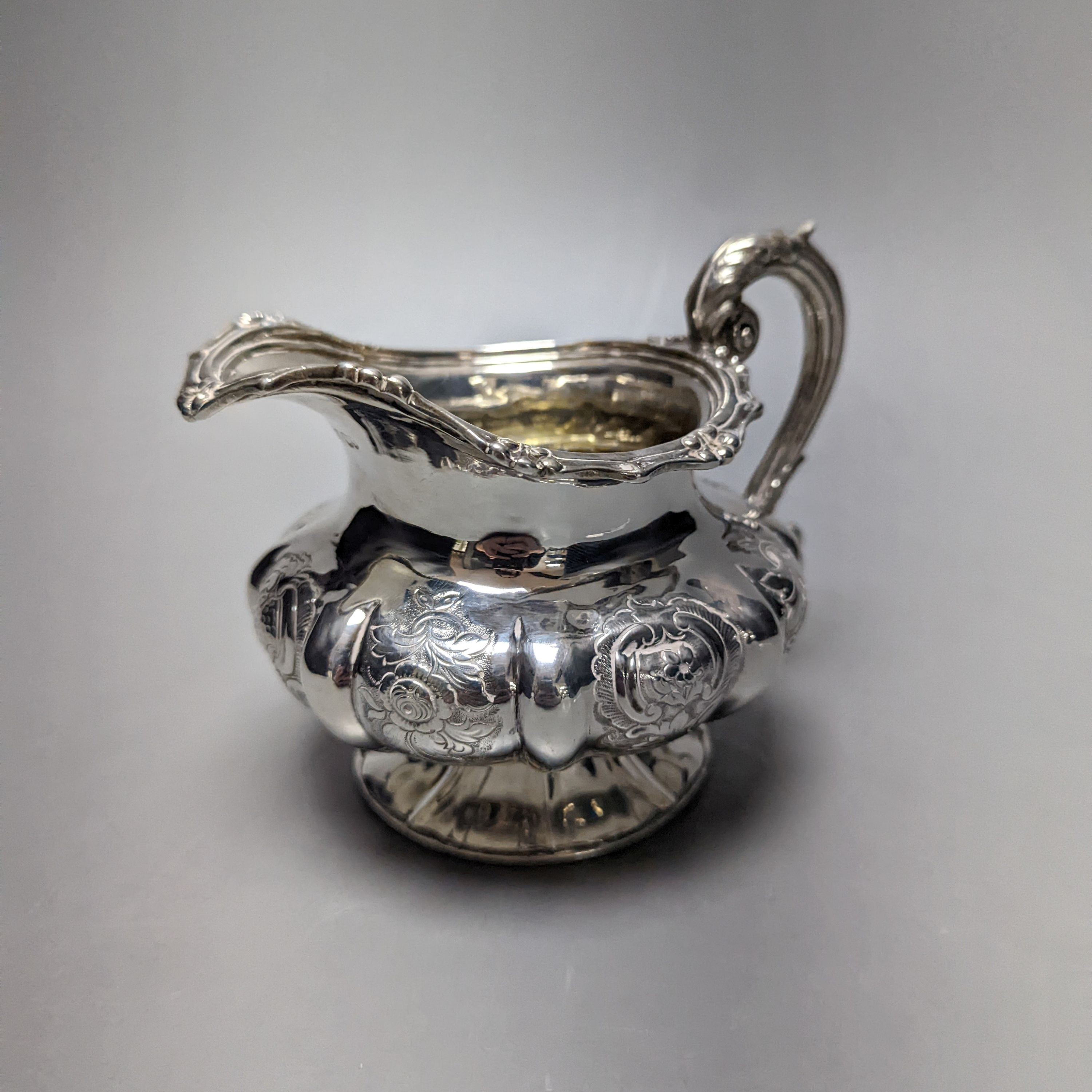 A Victorian embossed silver cream jug, J.E. Terry & Co, London, 1838, height 10.9cm
